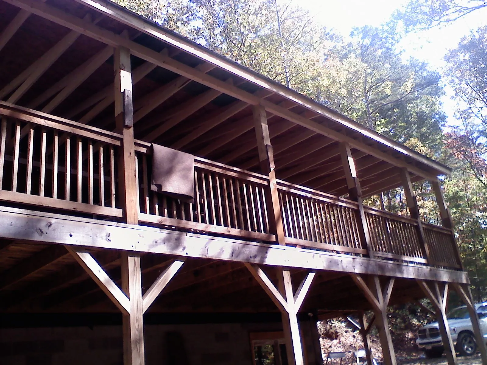 Timber framing under a new elevated porch and deck — Roof Leak Repair in Erie by Roofing Brothers
